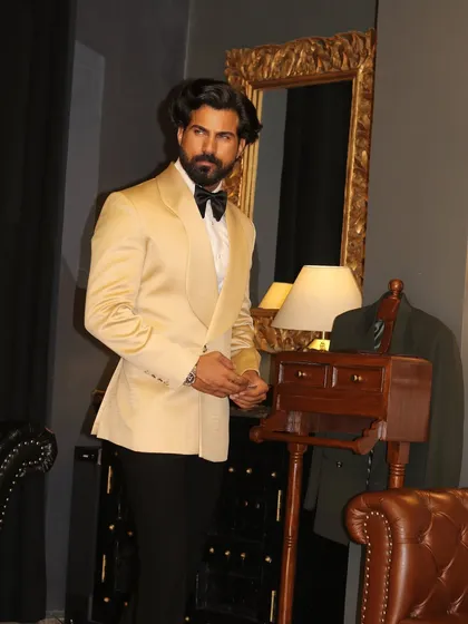 The clean lines of the ivory shawl lapel tuxedo are perfect for creating a sharp, memorable silhouette.