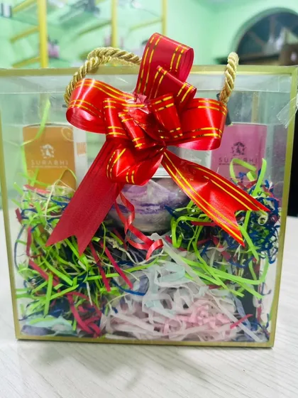 Another look at one of our custom gift hampers, complete with a beautiful red bow. We can create these for bulk orders or individual needs, all within your budget.