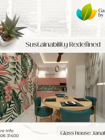 This dining space in a Janakpuri glass house shows our flair for creating vibrant, themed interiors. The tropical wallpaper, blush pink kitchen, and teal chairs come together to form a cohesive and inviting atmosphere.