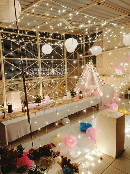 Another take on our popular terrace parties, this time with a soft pink and white theme. The fairy light canopy, teepee tent, and floor seating create a dreamy and comfortable atmosphere for any celebration.