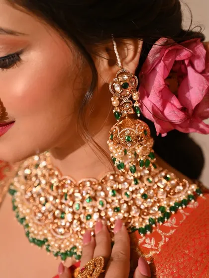 A close-up of my new obsession: using lotus flowers in bridal hairstyles. It adds a unique and beautiful touch to this traditional look.