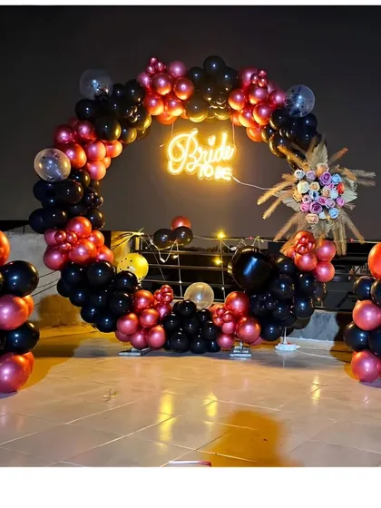 This full shot shows the complete bachelorette party backdrop, including the circular arch and matching balloon pillars, perfect for group photos.