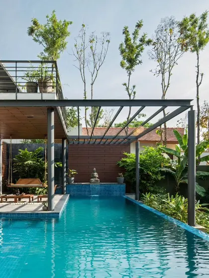 I believe in creating a seamless flow between indoor and outdoor living. This pool and deck at the Siri residence are designed as an extension of the home's living areas, offering a serene spot to enjoy the tropical landscape and the Bangalore weather.