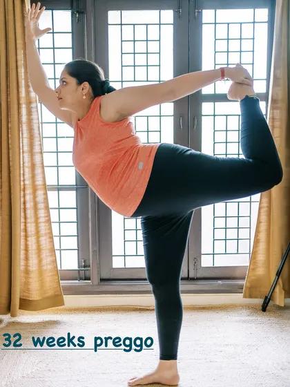 At 32 weeks pregnant, I continued to practice modified versions of my favorite asanas, like this Dancer's Pose. It helped me maintain flexibility and a strong connection to my changing body, reinforcing the safety and benefits of a guided practice.
