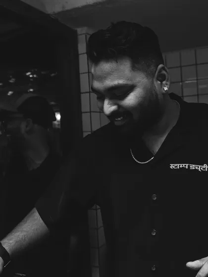 A candid black and white shot of me smiling during a set. This is my passion, and it shows.