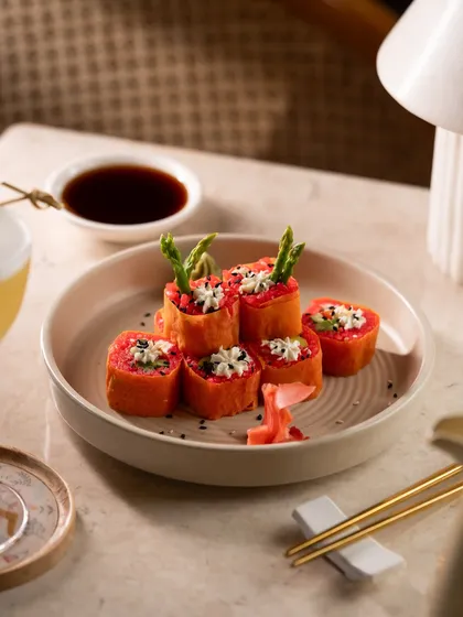Asparagus and cream cheese sushi rolls. The unique presentation with asparagus spears makes this dish visually interesting.