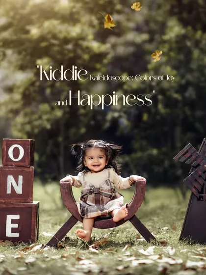A sweet outdoor portrait of a baby girl celebrating her first birthday. The falling leaves and rustic props create a warm, autumnal atmosphere for the photoshoot.