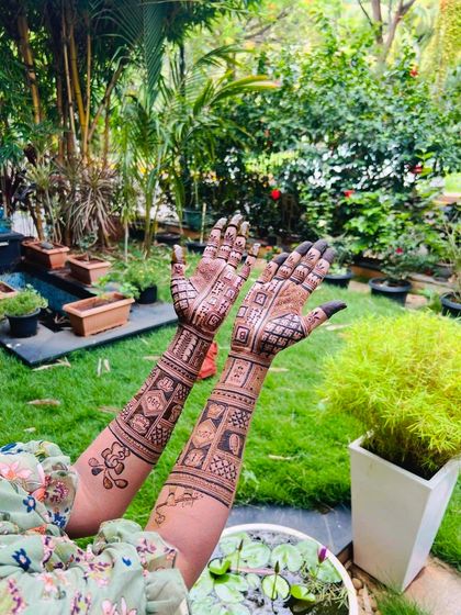 A lovely shot of a client's baby shower mehendi in a beautiful garden setting. The design is intricate and tells a story, perfect for celebrating this milestone.