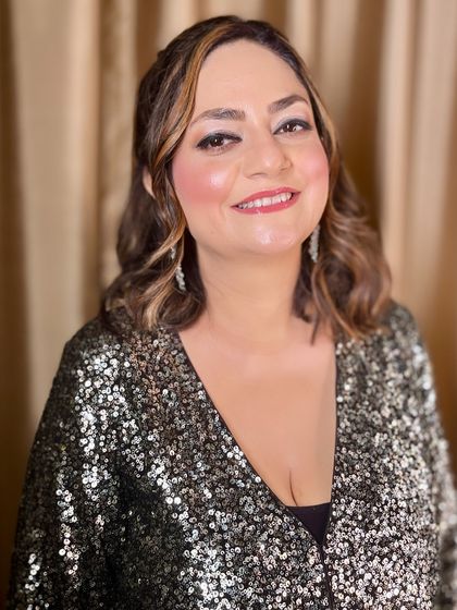 A happy and confident client, ready for her party.