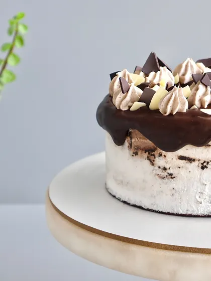 Another angle of this indulgent creation. The combination of rich chocolate, whipped cream, and a touch of Irish magic makes this cake a truly special treat.