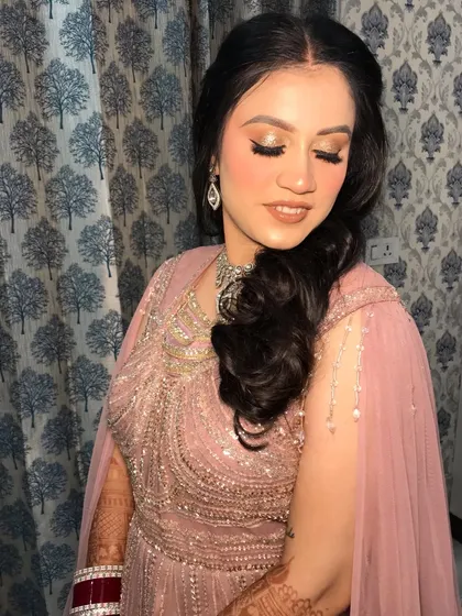 This angle shows the beautiful sparkle of the diamond necklace and earrings, perfect for a reception or cocktail party.