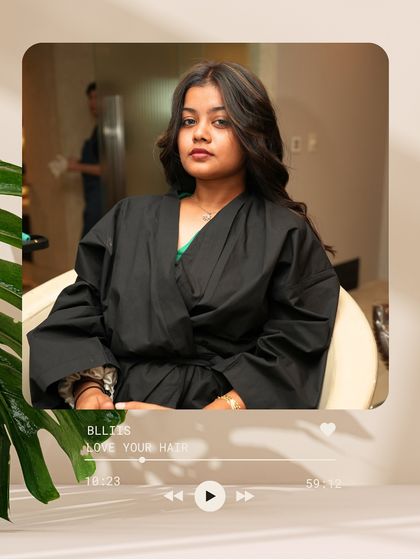 A moment of quiet confidence before the final styling. The new color has already brought so much life and richness to the hair.