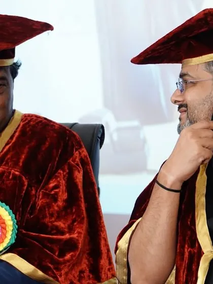 In conversation with the Chairman of Sri Krishna Degree College during the ceremony.