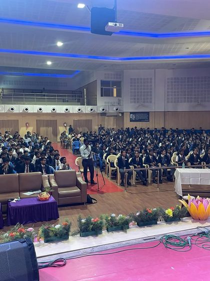 A packed auditorium for the Music Mania competition, showing the vibrant student music scene we are proud to be a part of.