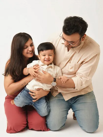 The family together, sharing a tickle and a laugh. These playful, candid moments are what make a family photoshoot so special and memorable.