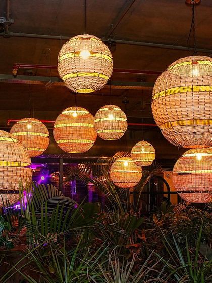 The beautiful, ambient lighting at TYD in Hennur, featuring hanging wicker lanterns that create a unique, upscale vibe for my Friday nights.