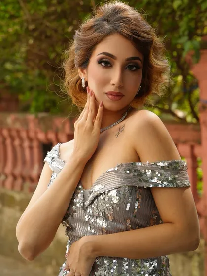Another angle of the silver sequin dress look, showcasing the flawless makeup and hair. Our photoshoots are designed to build a powerful portfolio.