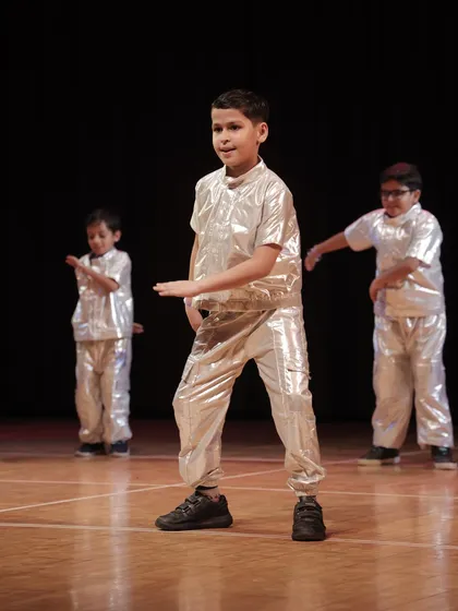 A close-up of a 'Swagger Boy' mid-performance, showing focus and attitude. We teach our students to perform with expression and confidence.