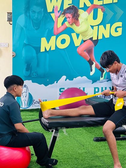 "Let the beauty of what you love be what you do." A moment of focused rehabilitation, where our physiotherapist works with a client on lower leg strengthening.