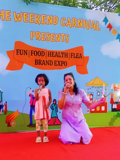 Another great moment with a young star at the carnival. Whether it's a singing performance or a fun game, I make sure to connect with participants at their level to make them feel comfortable and celebrated.