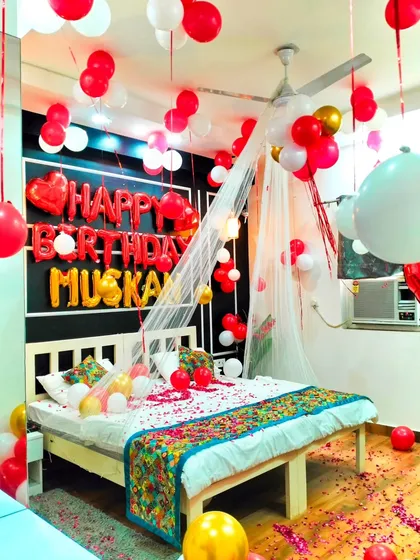 This image highlights the density of the balloon decorations, with many hanging from the ceiling and filling the room with color.