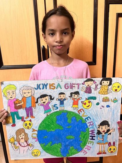 Ananya from 5th standard created this poster with the message "Joy is a gift is everywhere". Her drawing shows how art can be used to express positive ideas and feelings about the world.