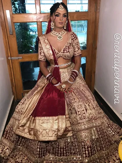 Another angle of the maroon and gold velvet lehenga, showing the rich color combination.