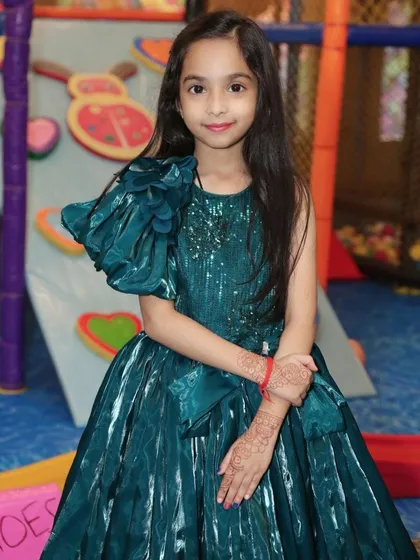 A stunning portfolio shot of a young participant, ready for the runway.