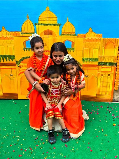 Celebrating festivals together. Here are our students dressed up for a cultural event, with their teacher right there with them.