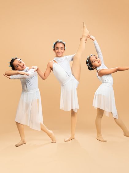 Three of our little stars from 'Liquid Soul' demonstrating their beautiful lines and flexibility. Every performance is a chance for them to shine.