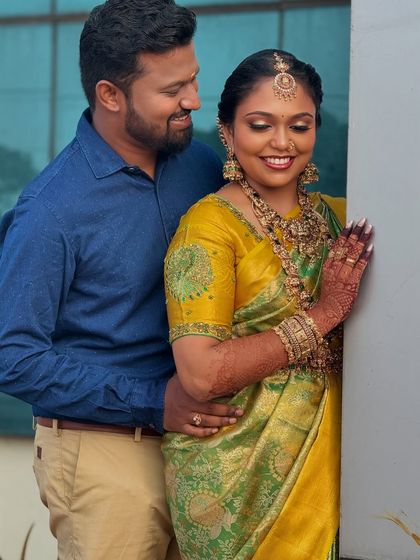 A sweet moment between Prithivi and her groom. Her makeup looks soft and romantic, perfect for these cherished couple portraits.