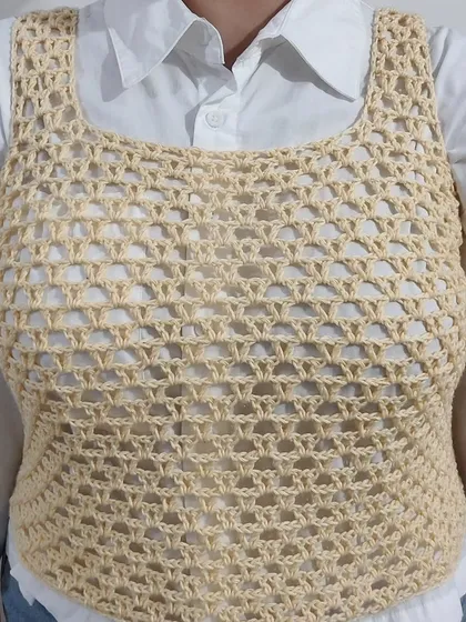 This is the Ophelia Tank Top, a simple and airy mesh top with a square neckline. It's a perfect layering piece for any season.