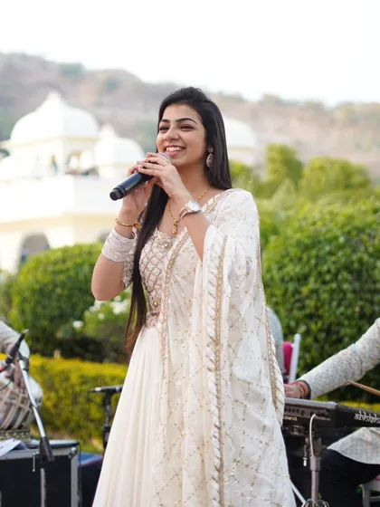 Performing at a beautiful outdoor event in Udaipur with my band. I travel across the country for destination weddings and special events, bringing customized musical experiences. Whether it's an intimate gathering or a large celebration, my team and I ensure the atmosphere is filled with divine music.