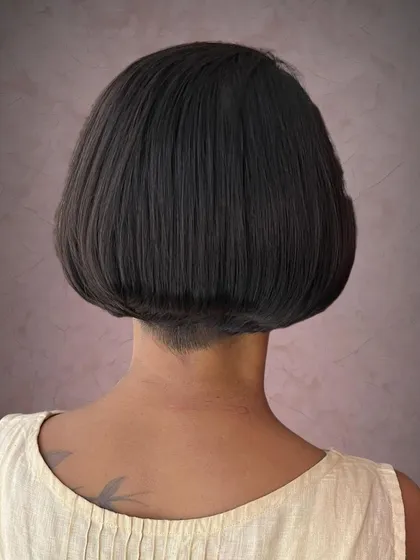 Details make the difference. This classic bob is given a modern edge with a clean, sharp undercut, which also helps reduce bulk for thicker hair types.