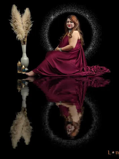 A full view of the dramatic fabric shoot, complete with a creative reflection effect that adds a layer of artistry and magic to the final portrait.