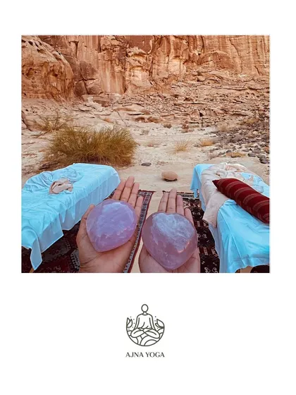 Holding the energy of love and healing with rose quartz crystals in the Al-Ula desert. We use tools from nature to help focus our intentions and deepen our practice.