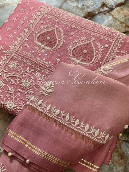 A detail shot of the sleeve and dupatta border, showing the fine craftsmanship.