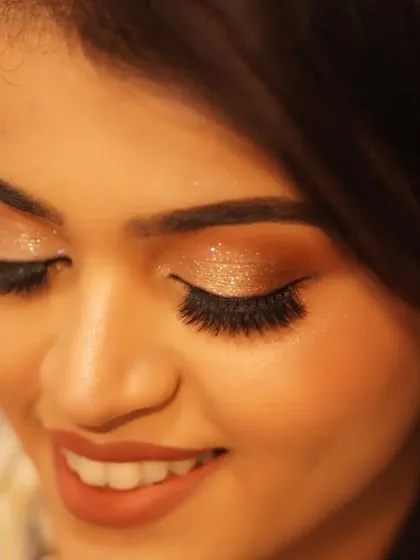 A close-up of the expertly applied glitter eyeshadow for Payal's reception. The texture and shine add a dimension of glamour that is perfect for an evening event.