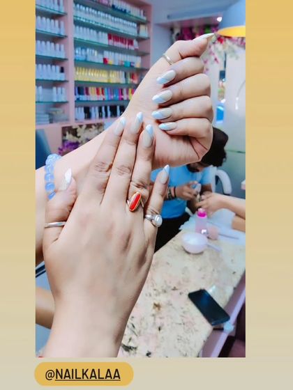 A beautiful set of nails with a soft, milky white finish. This look is clean, elegant, and timeless.