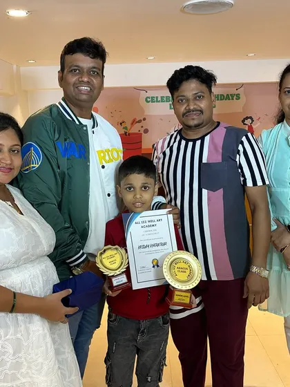 Kriday with his family, holding his trophies for completing both the Junior and Senior levels of our abacus program. A fantastic achievement!