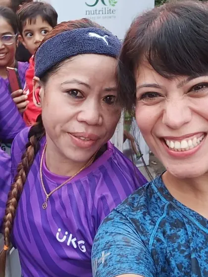 One of our team members gets a selfie with the legendary boxer Mary Kom at the UKG Unity Run. Our events often feature inspiring personalities.