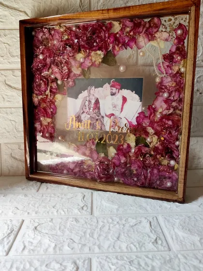 These images and videos showcase various angles and the creation process of my custom wedding and anniversary varmala preservation frames. Each one is made with love to turn your special memories into a timeless treasure.