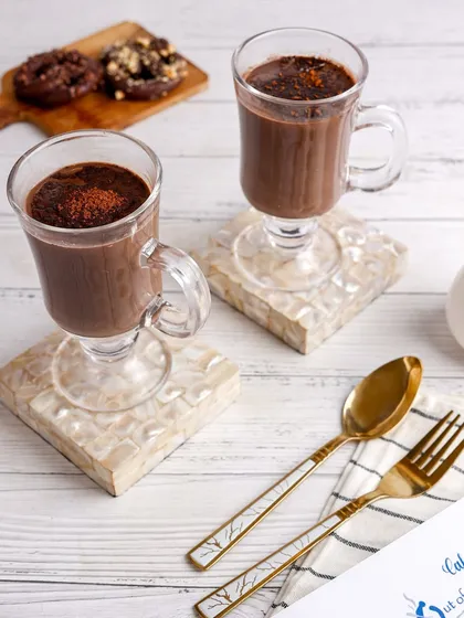 Cozy and comforting hot chocolate, styled for a cafe menu with a bright and airy feel.