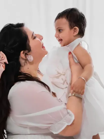A beautiful mother and daughter moment, filled with laughter and light. Our all-white setup is perfect for creating these bright, angelic portraits that feel both timeless and fresh.
