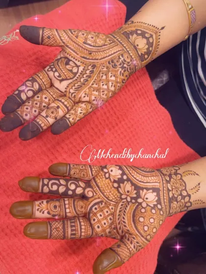 A rich, full-hand design combining floral, paisley, and geometric patterns for a classic festive mehendi.
