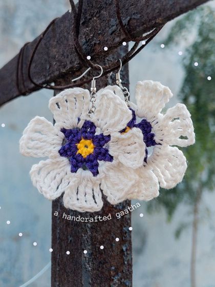 For those who aren't afraid to be bold. These large white and purple floral earrings make a huge statement and are perfect for a vacation or a special day out.