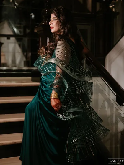 A series of portraits showcasing the bride's elegant and modern reception look, highlighting the details of her designer saree.