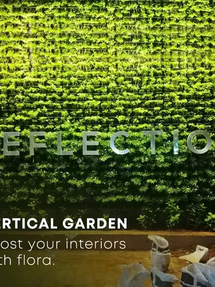 An outdoor vertical garden under construction, showing the scale of what's possible. Once fully grown, this "reflection" wall will become a massive green facade, boosting the building's aesthetic and environmental credentials.