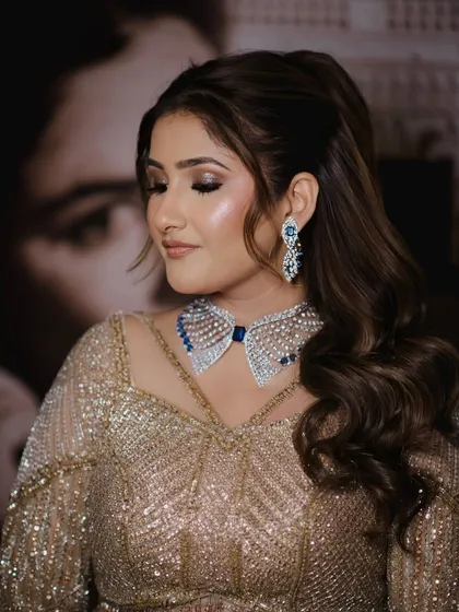 A close-up of the sangeet glam, focusing on the beautifully blended eyeshadow and the unique collar-style necklace.