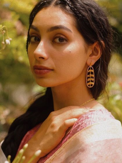 A soft, natural light portrait for The Jewelry Project, featuring elegant earrings. This style is perfect for brands aiming for an organic and sophisticated look for their social media.